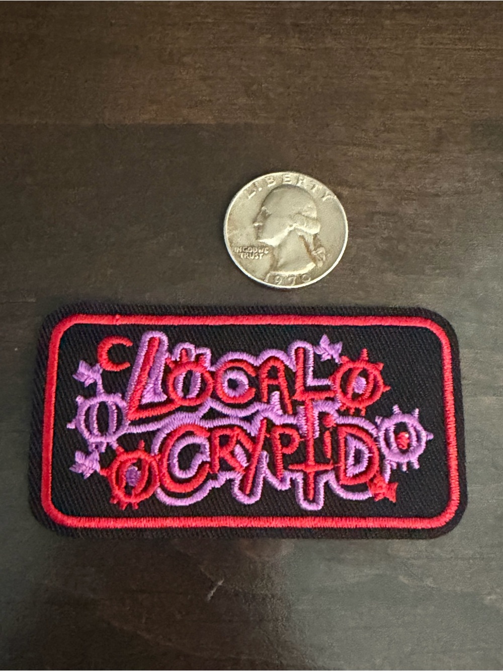 Black Embroidered 'Local Cryptid' Patch with Pink & Purple Thread